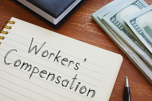 Pennsylvania Workers' Compensation forms show in conceptual business photo
